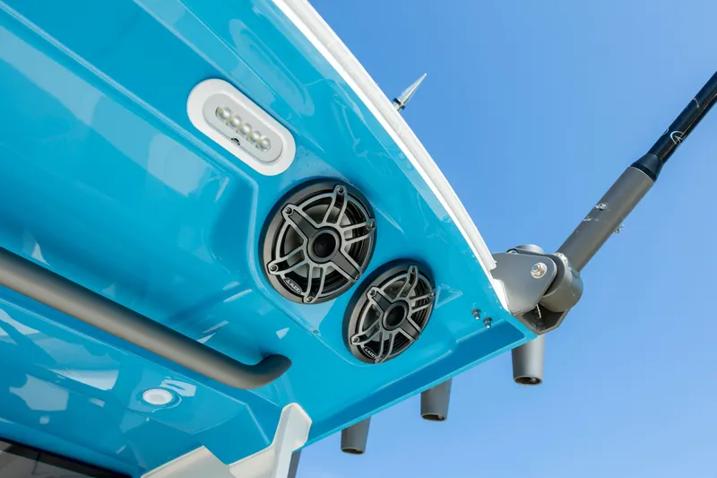  Yacht Photos Pics 2022 Solace 41 CS boat speakers and rod holders against clear blue sky.