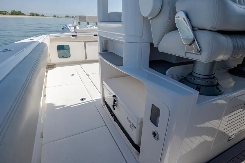  Yacht Photos Pics 2022 Solace 41 CS boat interior with seating and storage, on calm water.