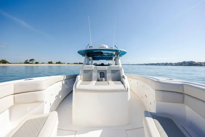  Yacht Photos Pics 2022 Solace 41 CS boat on calm water, showcasing spacious deck and modern design.