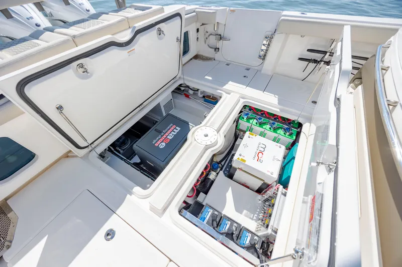  Yacht Photos Pics 2022 Solace 41 CS boat storage compartments with batteries and equipment, open on deck.
