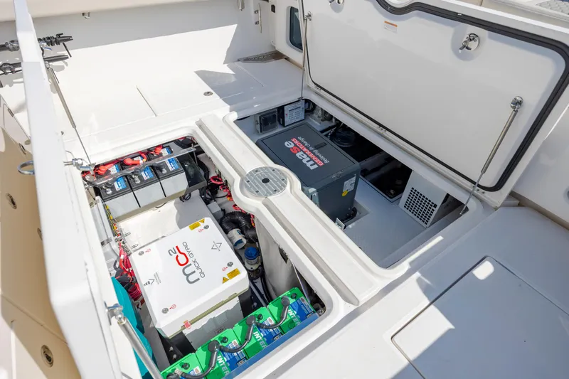  Yacht Photos Pics 2022 Solace 41 CS boat engine compartment with batteries and electrical components.
