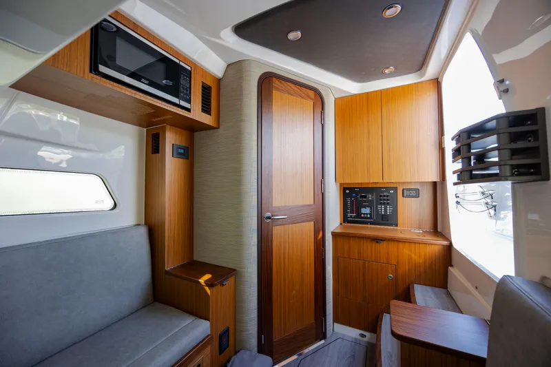  Yacht Photos Pics Interior of 2022 Solace 41 CS boat with wood paneling and modern amenities.