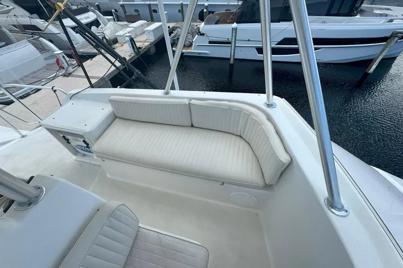 Happy Our's Yacht Photos Pics 1997 Ocean Yachts 48 Super Sport boat interior with white cushioned seating.