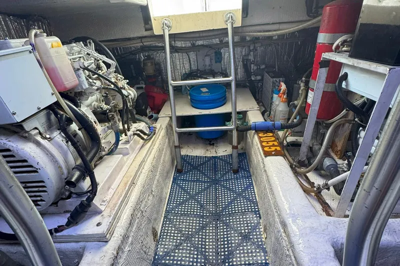 Happy Our's Yacht Photos Pics Engine room of a 1997 Ocean Yachts 48 Super Sport, featuring machinery and equipment.