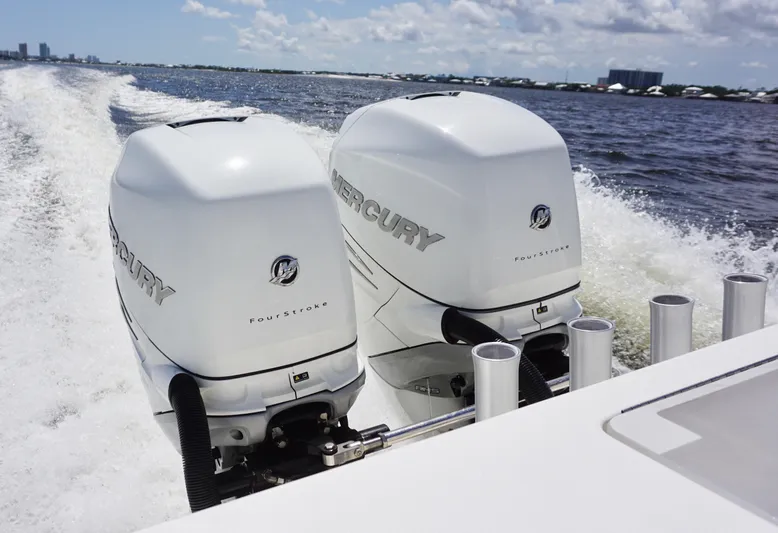  Yacht Photos Pics 2009 SeaVee 32OB boat with twin Mercury outboard engines cruising on open water.