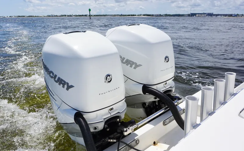  Yacht Photos Pics Twin Mercury outboard engines on a 2009 SeaVee 32OB boat cruising on open water.