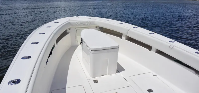  Yacht Photos Pics 2009 SeaVee 32OB boat deck with seating, on calm water.