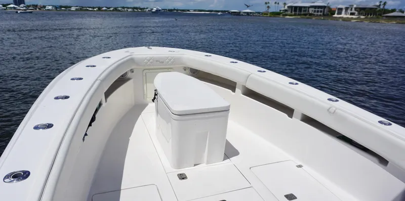  Yacht Photos Pics 2009 SeaVee 32OB boat deck with seating, on calm water, under clear skies.