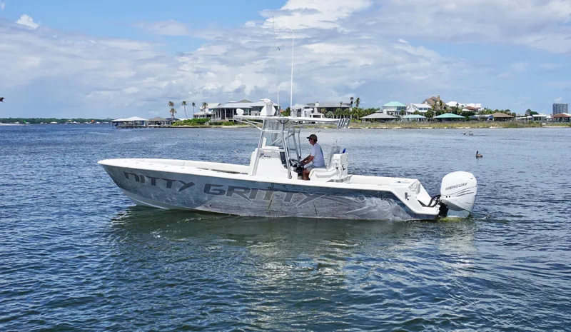  Yacht Photos Pics 2009 SeaVee 32OB boat on water, clear sky, coastal background.