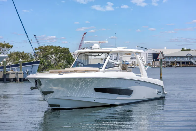  Yacht Photos Pics 2018 Boston Whaler 420 Outrage boat on calm water, clear sky background.