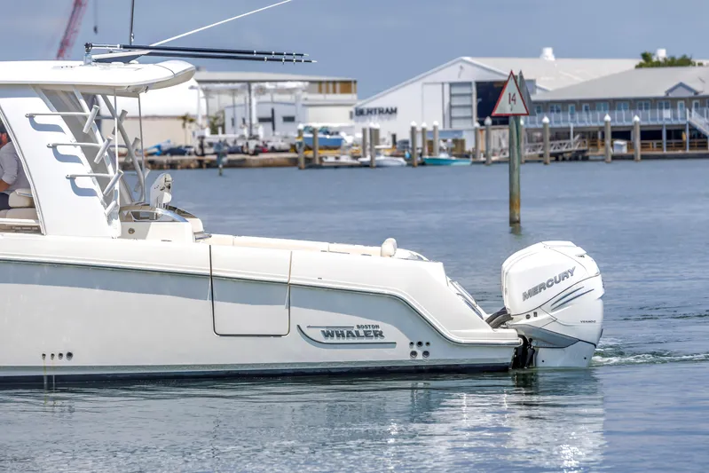  Yacht Photos Pics 2018 Boston Whaler 420 Outrage boat with Mercury engine on calm water.
