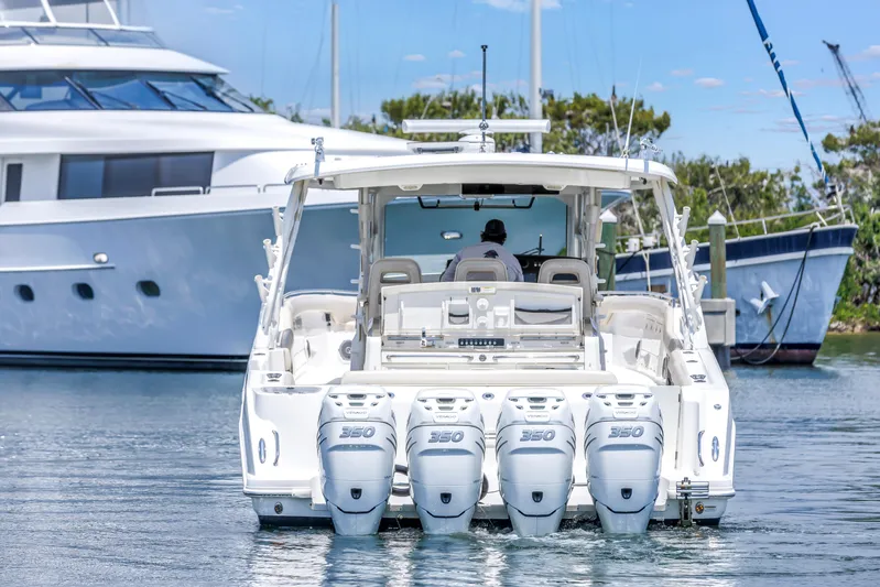  Yacht Photos Pics 2018 Boston Whaler 420 Outrage with four powerful engines, docked near luxury yachts.