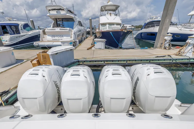  Yacht Photos Pics 2018 Boston Whaler 420 Outrage with four outboard engines docked at a marina.
