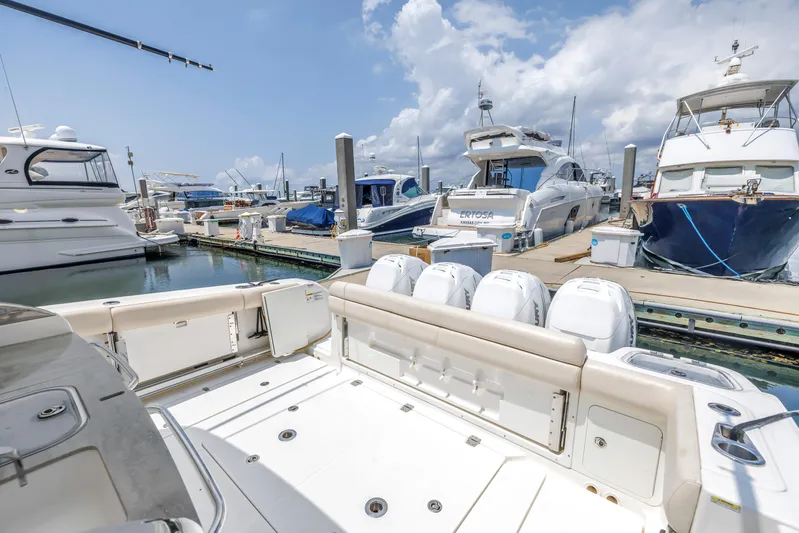  Yacht Photos Pics 2018 Boston Whaler 420 Outrage docked at marina with other luxury boats.