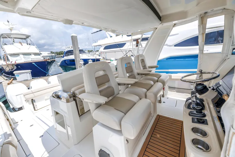  Yacht Photos Pics 2018 Boston Whaler 420 Outrage interior with luxurious seating and control panel.