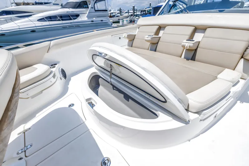  Yacht Photos Pics 2018 Boston Whaler 420 Outrage boat interior with open storage compartment.