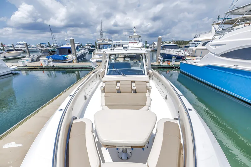  Yacht Photos Pics 2018 Boston Whaler 420 Outrage docked at marina, surrounded by other boats.