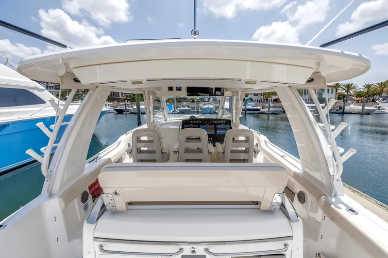 Yacht Photos Pics 2018 Boston Whaler 420 Outrage boat interior with seating, docked at marina.