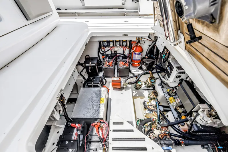  Yacht Photos Pics Engine compartment of a 2018 Boston Whaler 420 Outrage, showcasing batteries and wiring.