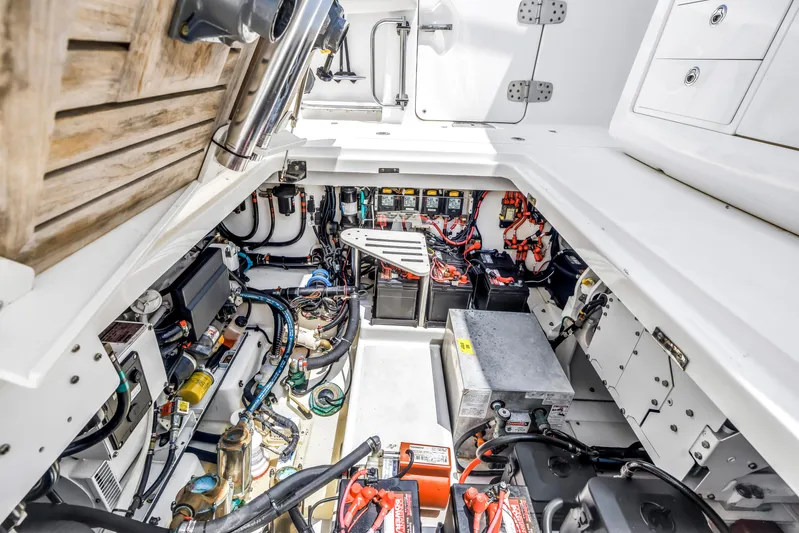  Yacht Photos Pics Engine room of 2018 Boston Whaler 420 Outrage, showcasing complex wiring and equipment.