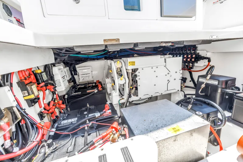  Yacht Photos Pics Engine compartment of 2018 Boston Whaler 420 Outrage, showcasing wiring and mechanical components.