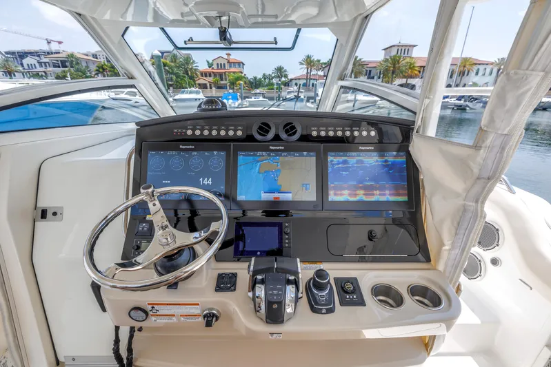  Yacht Photos Pics 2018 Boston Whaler 420 Outrage helm with advanced navigation displays and controls.