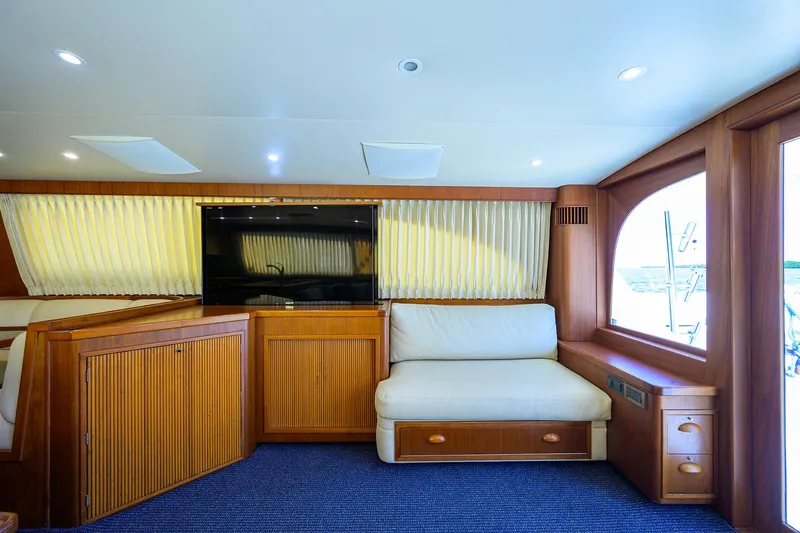 Hurricane Yacht Photos Pics Interior of 1997 Garlington 61 Convertible yacht with wood paneling and seating area.