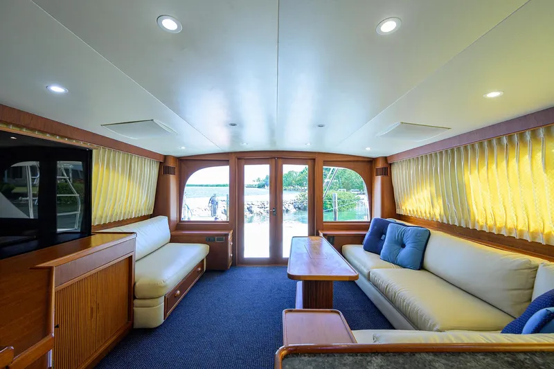 Hurricane Yacht Photos Pics Luxurious interior of a 1997 Garlington 61 Convertible yacht with plush seating and elegant decor.