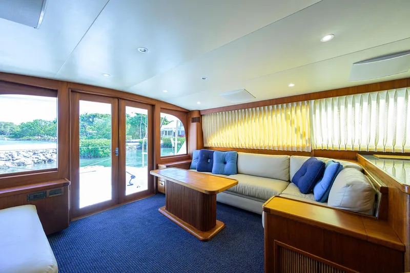 Hurricane Yacht Photos Pics Luxurious interior of a 1997 Garlington 61 Convertible yacht with plush seating and wooden accents.