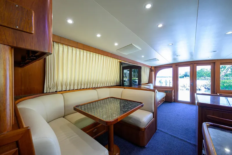 Hurricane Yacht Photos Pics Luxurious interior of a 1997 Garlington 61 Convertible yacht with elegant seating and wooden accents.