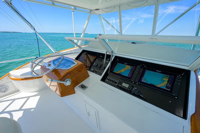 Hurricane Yacht Photos Pics 1997 Garlington 61 Convertible yacht helm with navigation screens and ocean view.