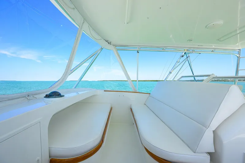 Hurricane Yacht Photos Pics 1997 Garlington 61 Convertible interior with ocean view, featuring white seating and sleek design.