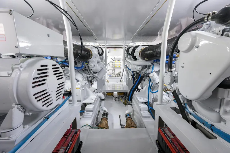 Hurricane Yacht Photos Pics Engine room of a 1997 Garlington 61 Convertible, showcasing dual engines and mechanical components.
