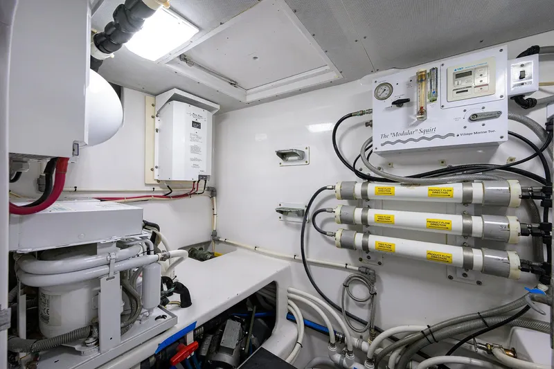 Hurricane Yacht Photos Pics Engine room of a 1997 Garlington 61 Convertible yacht, showcasing equipment and wiring.