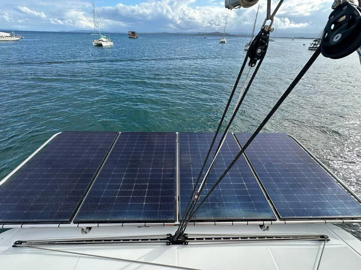Uni Yacht Photos Pics Solar panels on 2023 Lagoon 46 catamaran, ocean view in background.