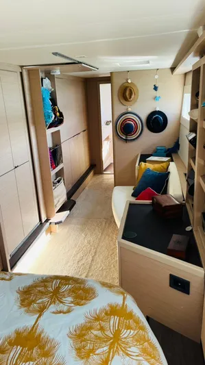 Uni Yacht Photos Pics Interior of 2023 Lagoon 46 yacht with modern decor and cozy seating area.