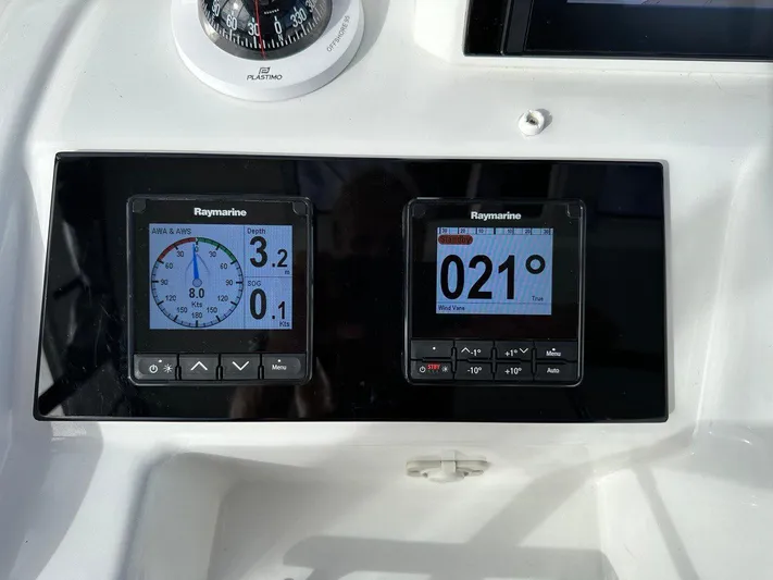 Uni Yacht Photos Pics Control panel of 2023 Lagoon 46 with Raymarine displays and compass.