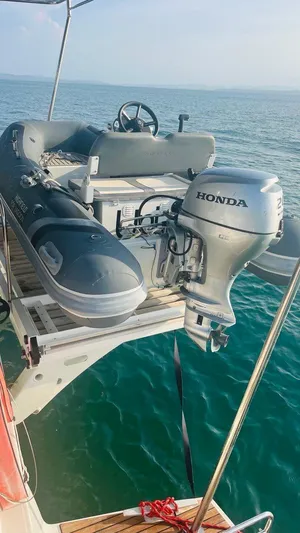 Uni Yacht Photos Pics 2023 Lagoon 46 yacht with Honda outboard motor on a calm sea.