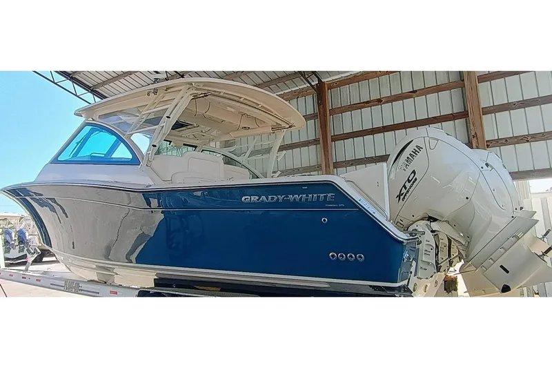 375-307 Brokerage Ron Yacht Photos Pics 2025 Grady-White Freedom 375 boat with Yamaha XTO engines in a covered storage area.