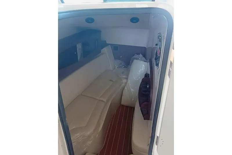 375-307 Brokerage Ron Yacht Photos Pics Interior cabin of 2025 Grady-White Freedom 375 boat, featuring seating and storage.