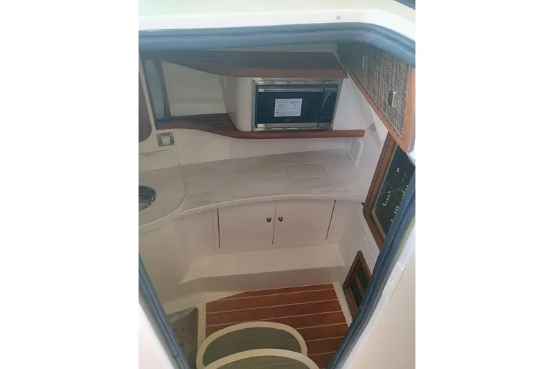 375-307 Brokerage Ron Yacht Photos Pics 2025 Grady-White Freedom 375 cabin interior with wood accents and modern amenities.