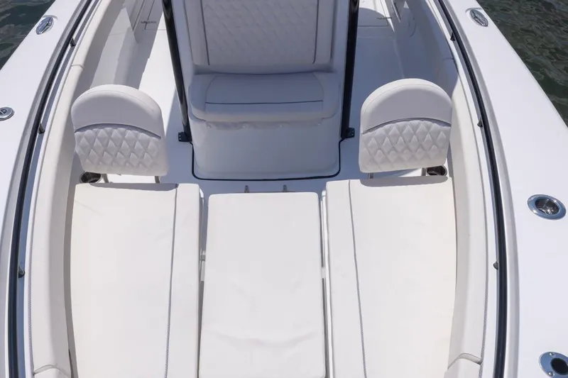  Yacht Photos Pics 2026 Sea Hunt Gamefish 25 boat interior with white cushioned seating and sleek design.