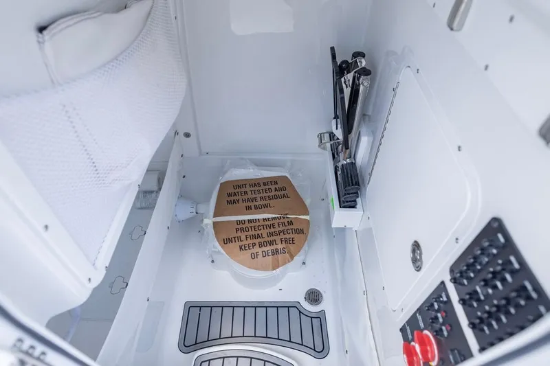  Yacht Photos Pics Interior of 2026 Sea Hunt Gamefish 25 boat, featuring a compact restroom area.