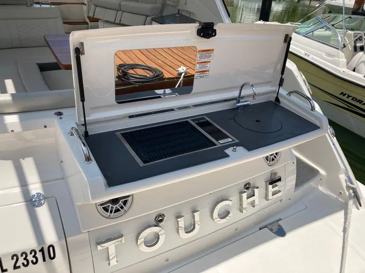 2021 Sea Ray 350 Sundancer @ Cancun Yacht Photos Pics 2021 Sea Ray Sundancer 350 with outdoor grill and sink on deck.