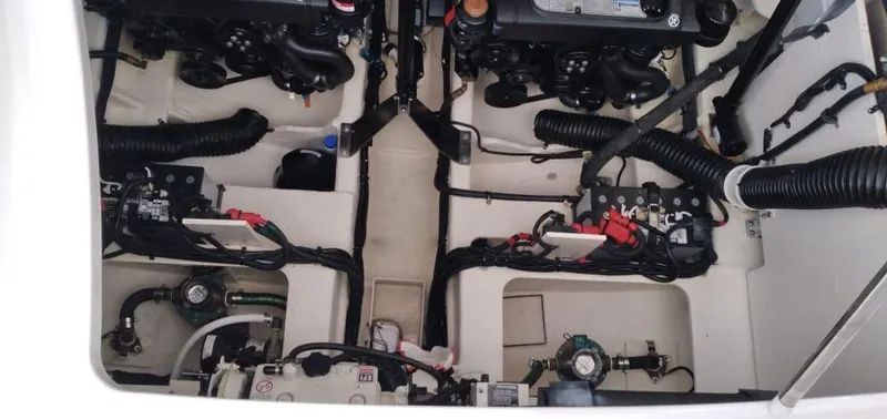 2021 Sea Ray 350 Sundancer @ Cancun Yacht Photos Pics Engine compartment of 2021 Sea Ray Sundancer 350, showcasing dual engines and wiring.