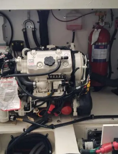 2021 Sea Ray 350 Sundancer @ Cancun Yacht Photos Pics Engine compartment of a 2021 Sea Ray Sundancer 350 with visible fire extinguisher.