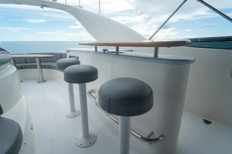 Living The Dream Yacht Photos Pics Luxurious 2008 Lazzara 84 Open Bridge yacht with elegant seating and ocean view.