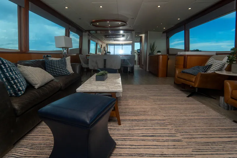 Living The Dream Yacht Photos Pics Luxurious interior of 2008 Lazzara 84 Open Bridge yacht with elegant seating and panoramic windows.