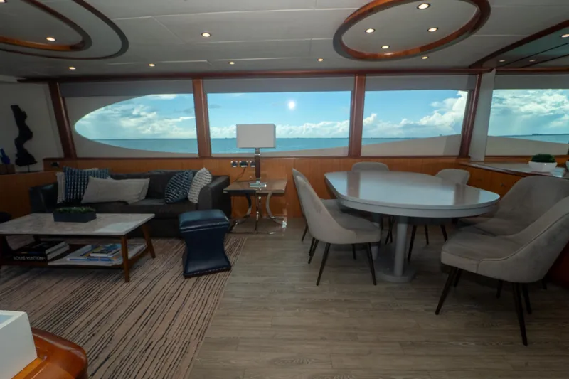 Living The Dream Yacht Photos Pics Luxurious interior of 2008 Lazzara 84 Open Bridge yacht with ocean view windows.