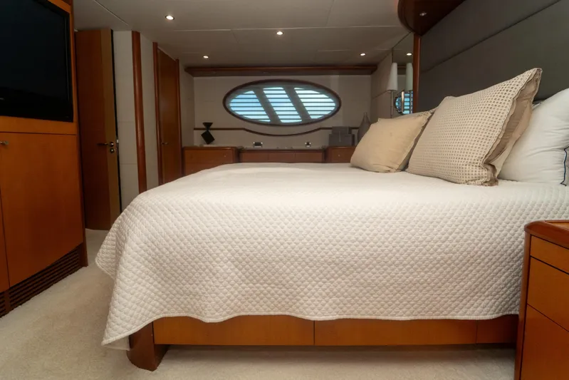 Living The Dream Yacht Photos Pics Luxurious bedroom interior of 2008 Lazzara 84 Open Bridge yacht with elegant bedding.